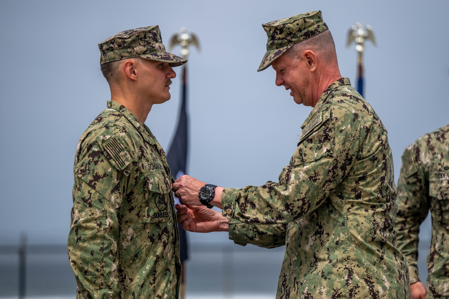 Utilitiesman 1st Class Steven Schumacher shakes the hand of Rear Adm. Dean VanderLey, commander, Naval Facilities Engineering Systems Command, at the Silver Strand Training Complex in San Diego.
