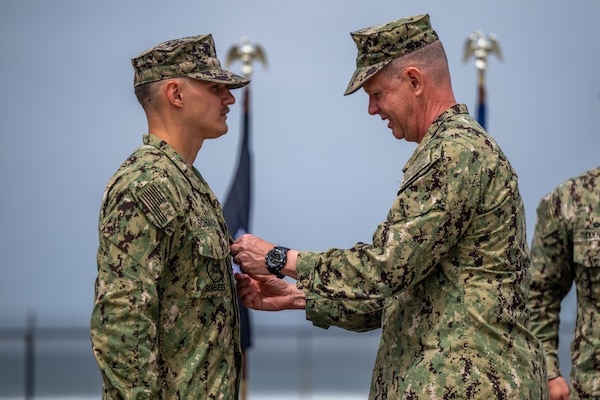 Utilitiesman 1st Class Steven Schumacher shakes the hand of Rear Adm. Dean VanderLey, commander, Naval Facilities Engineering Systems Command, at the Silver Strand Training Complex in San Diego.