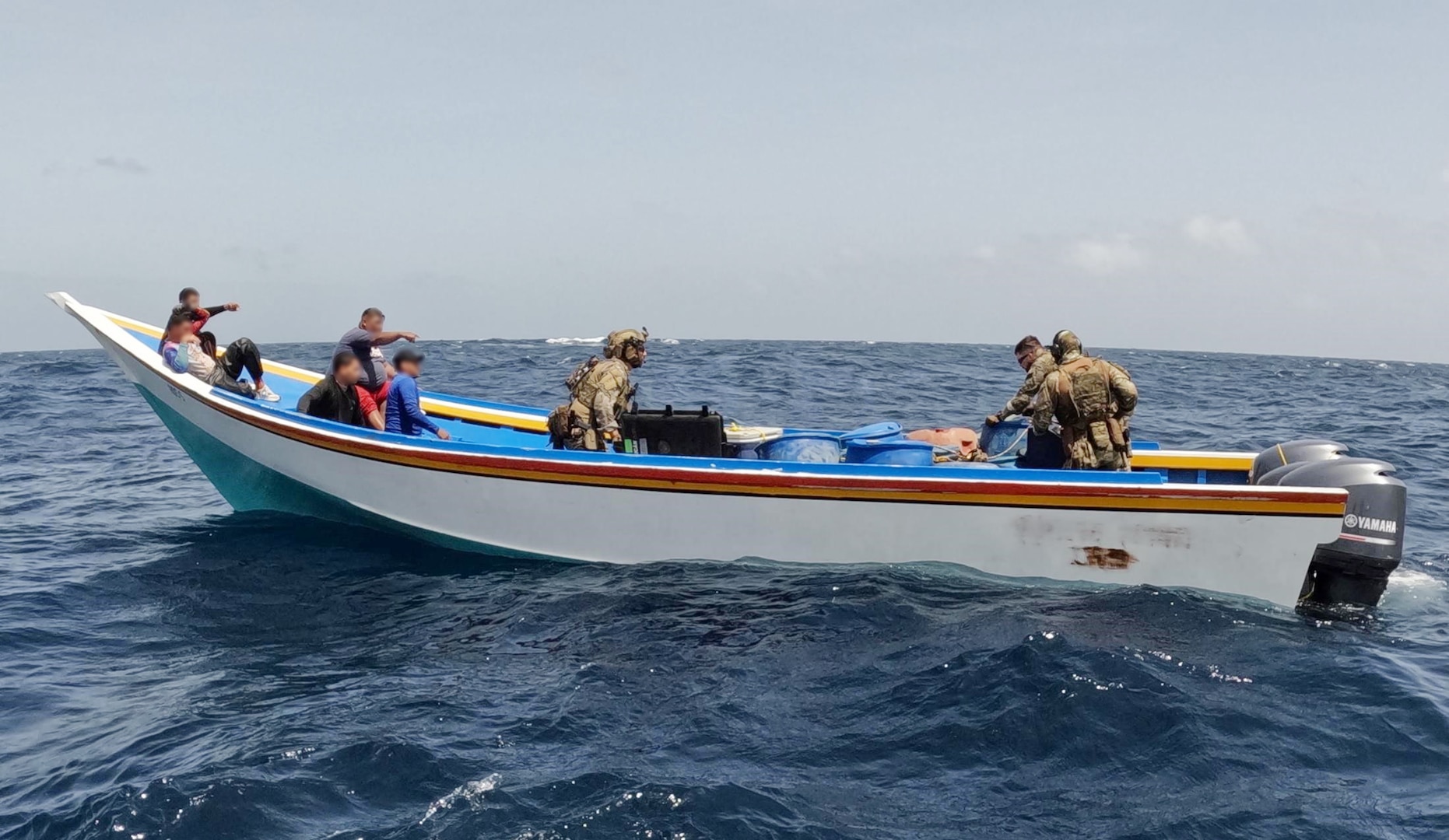 Coast Guard law enforcement officers apprehend a suspected drug smuggling vessel