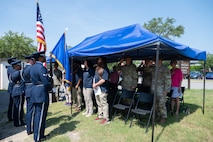 Lindy Cobb, Senior Director of Base Supply Center Operations, gives a speech during the 25th anniversary of the Base Supply Center.