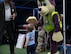 A child high-fives a mascot during Freedom Fest at Minot Air Force Base, North Dakota, June 27, 2025. Freedom Fest had music, food, games and fireworks for the Team Minot community to enjoy. (U.S. Air Force photo by Airman 1st Class Wesley Davies)