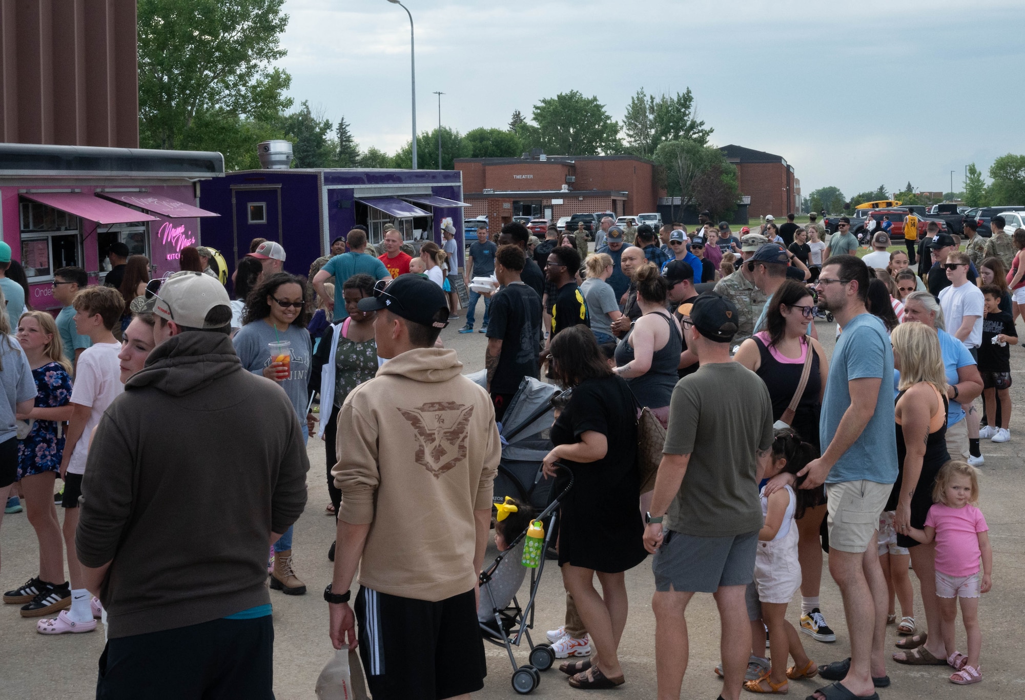 Airmen and their families gather at Freedom Fest for food and community at Minot Air Force Base, North Dakota, June 27, 2025. Airmen and their families enjoyed an evening filled with meals from food vendors, music and a fireworks display that fostered a connection with the community. (U.S. Air Force photo by Airman 1st Class Wesley Davies)