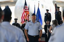A photo of an Airmen standing at attention.