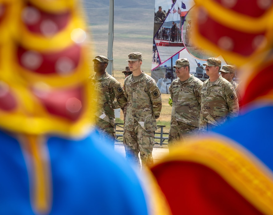 Multinational soldiers stand in formation during the closing ceremony of Khaan Quest 2025, on June 28, 2025, at Five Hills Training Area.