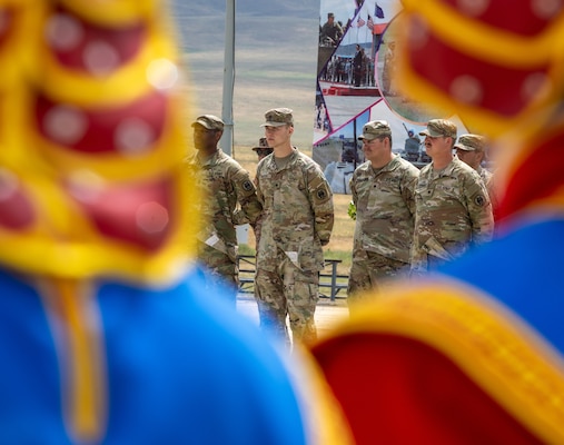 Multinational soldiers stand in formation during the closing ceremony of Khaan Quest 2025, on June 28, 2025, at Five Hills Training Area.