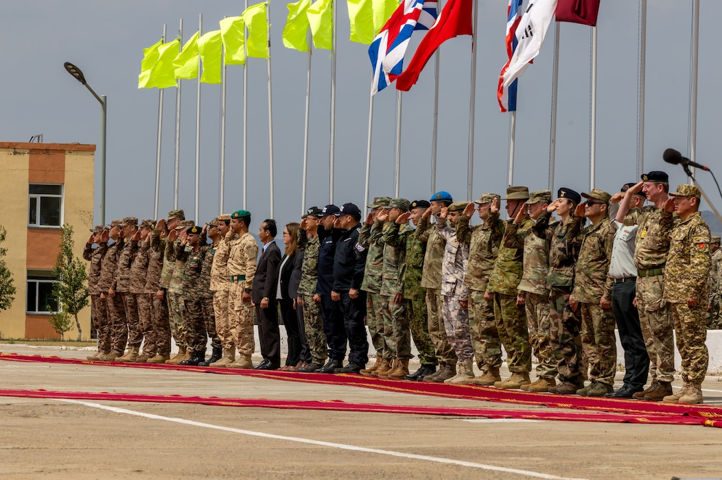 Multinational distinguished guests render honors during the closing ceremony of Khaan Quest 2025, on June 28, 2025, at Five Hills Training Area.