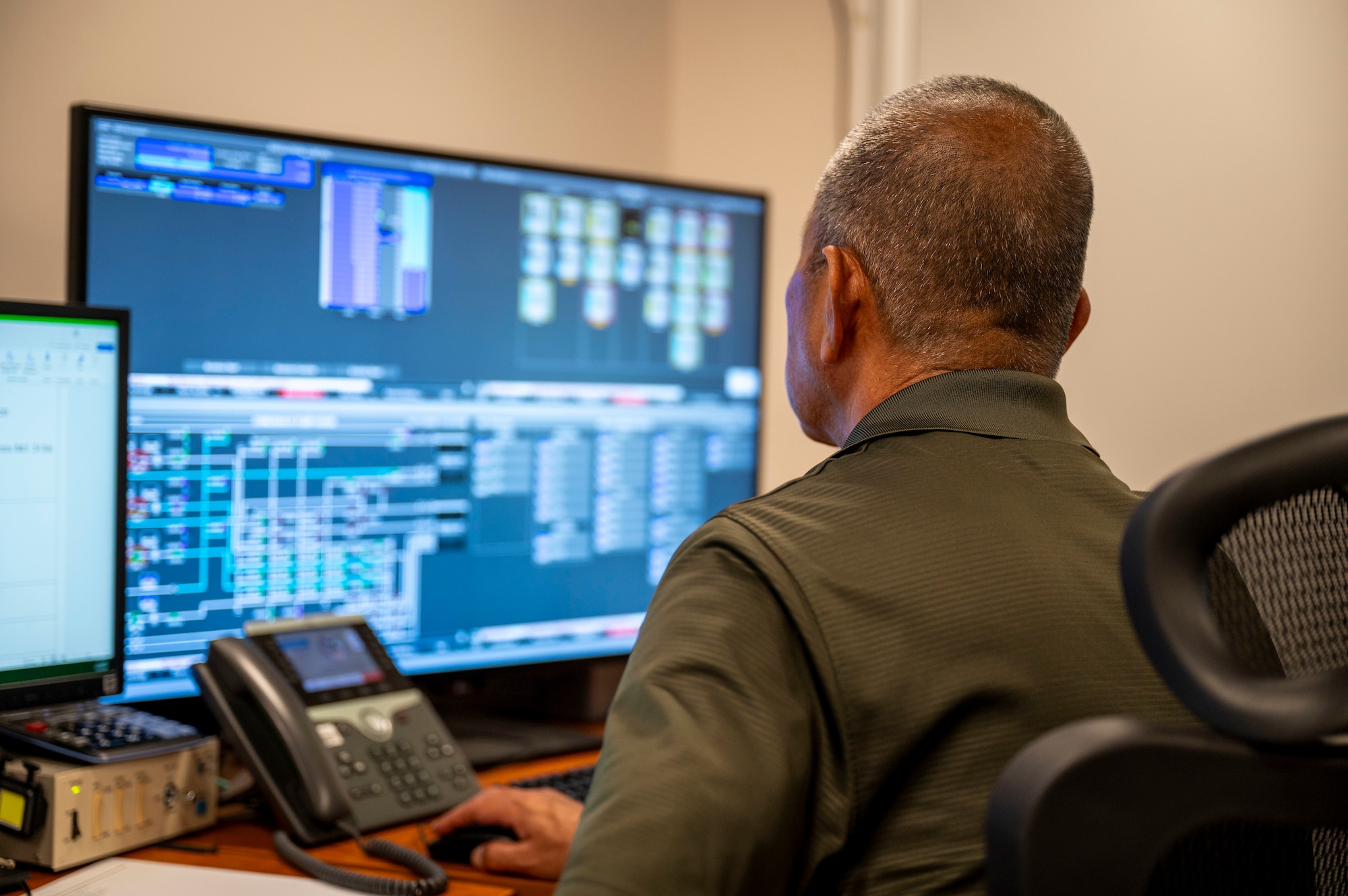 Toshihide Smimoji, Defense Logistics Agency Energy Okinawa control room foreman, monitors fuel lines and levels near Kadena Air Base, Japan