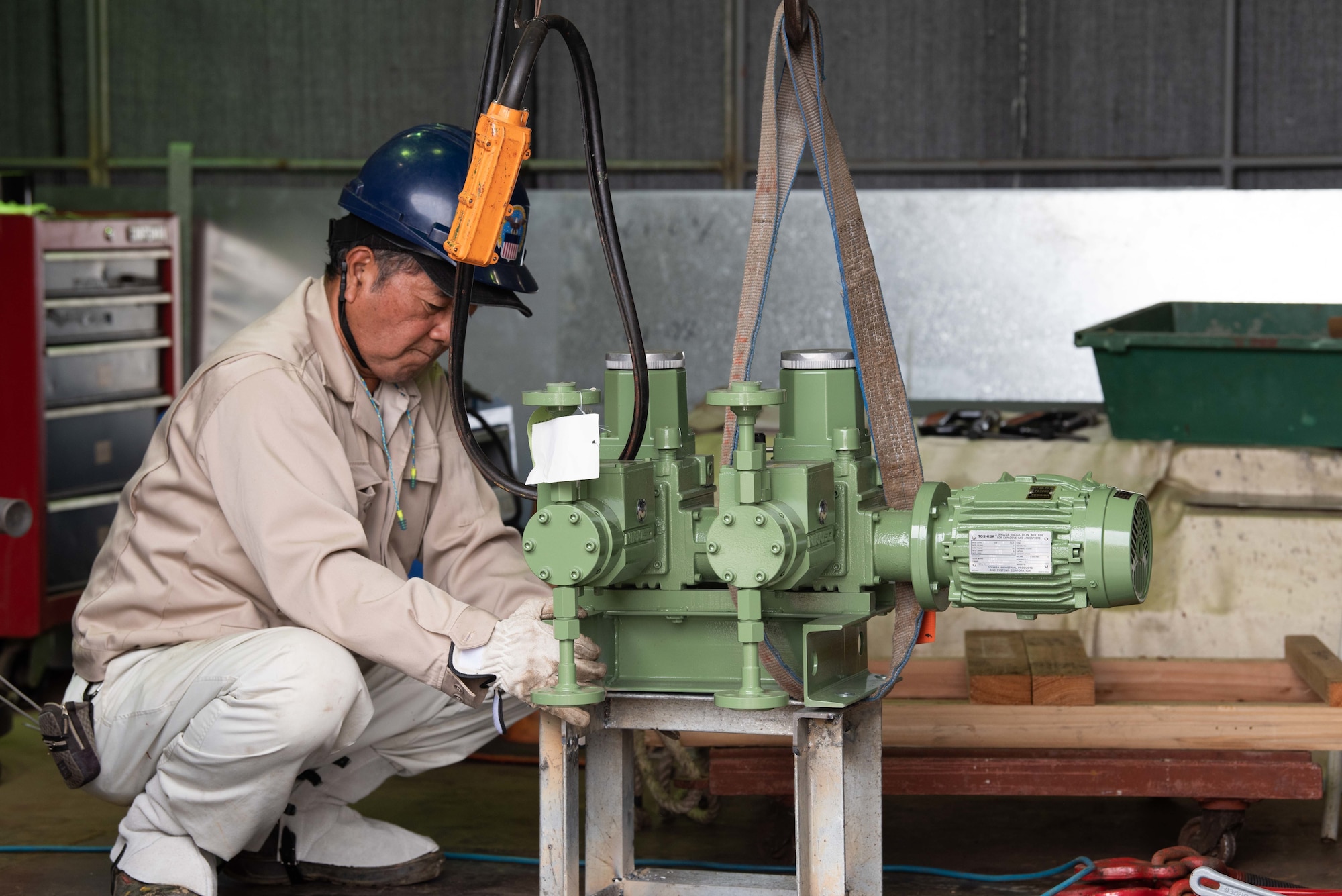 Hideki Oshiro, Defense Logistics Agency fuels distribution mechanic, inspects a metal pipe Mar. 8, 2019, at Camp Courtney, Japan.