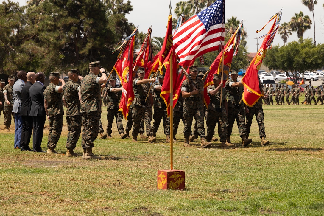 The I Marine Expeditionary Force commanding general and past and present I MEF command senior enlisted leaders salute the colors as they pass in review during a relief and appointment ceremony at Marine Corps Base Camp Pendleton, California, July 2, 2025.