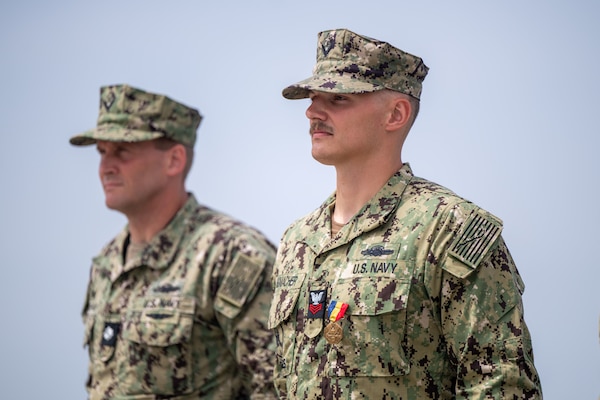 Utilitiesman 1st Class Steven Schumacher shakes the hand of Rear Adm. Dean VanderLey, commander, Naval Facilities Engineering Systems Command, at the Silver Strand Training Complex in San Diego.