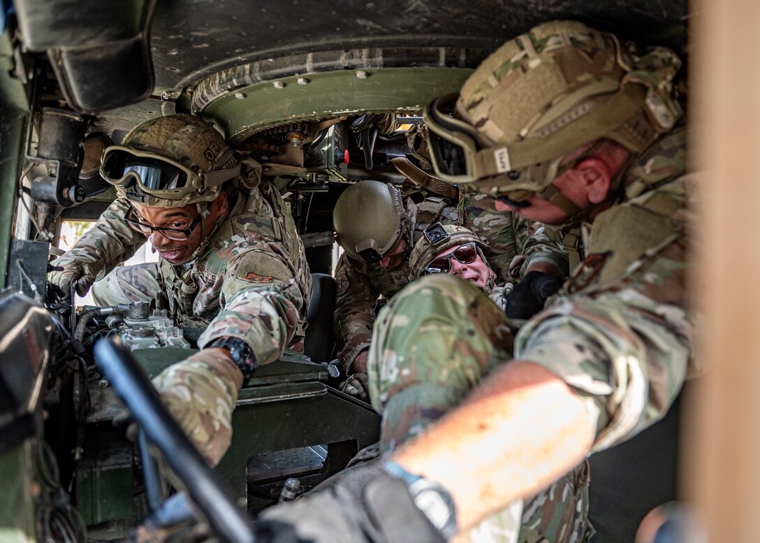 Airmen in humvee