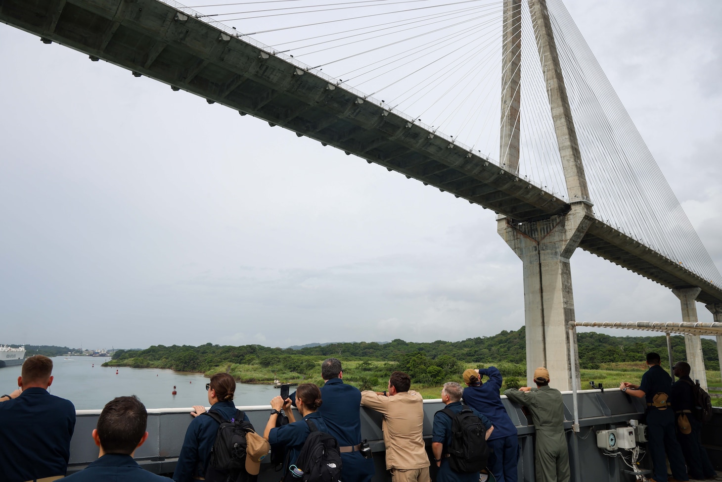 250701-A-LS473-1017 PANAMA CANAL, Panama (July 1, 2025) Sailors aboard the Mercy-class hospital ship USNS Comfort (T-AH 20) pass under Centennial Bridge as they transit the Panama Canal during Continuing Promise 2025, July 1, 2025. Continuing Promise 2025 is the 16th iteration of the U.S. 4th Fleet/U.S. Naval Forces Southern Command-led mission since 2007, which aims to foster goodwill, strengthen existing partnerships with partner nations, and form new partnerships between host nations, non-federal entities, and international organizations. (U.S. Army photo by Cpl. William Hunter)