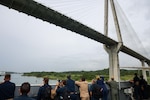 250701-A-LS473-1017 PANAMA CANAL, Panama (July 1, 2025) Sailors aboard the Mercy-class hospital ship USNS Comfort (T-AH 20) pass under Centennial Bridge as they transit the Panama Canal during Continuing Promise 2025, July 1, 2025. Continuing Promise 2025 is the 16th iteration of the U.S. 4th Fleet/U.S. Naval Forces Southern Command-led mission since 2007, which aims to foster goodwill, strengthen existing partnerships with partner nations, and form new partnerships between host nations, non-federal entities, and international organizations. (U.S. Army photo by Cpl. William Hunter)