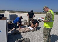Sgt. 1st Class Tie Wu, right, a medical logistics NCO with the U.S. Army Medical Materiel Agency, conducts inventory during retrograde operations alongside USAMMA contractors and members of the 86th Infantry Brigade Combat Team in Greece over the closing days of the DEFENDER 2025 exercises in Europe.