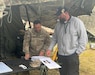 Jessy Moore, right, a logistics assistance representative with U.S. Army Medical Logistics Command, supports a member of the 512th Field Hospital, based at Kaiserslautern, Germany, and part of the 519th Hospital Center, during the hospital exercise portion of DEFENDER 2025 in Lithuania.