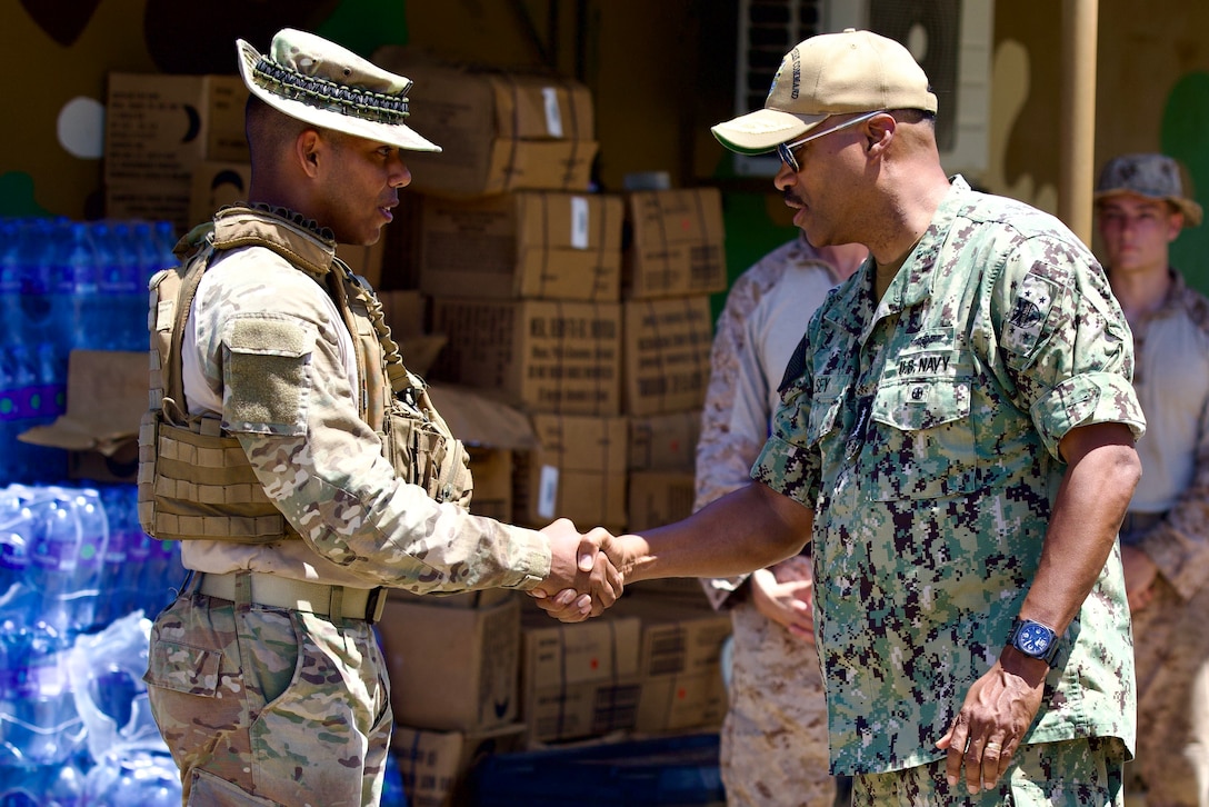 U.S. Navy Adm. Alvin Holsey, right, commander, U.S. Southern Command, congratulates National Aeronaval Service of Panama Lt. Jesús Chen for his contribution to the success of the second training iteration with U.S. Marines and Panamanians, June 26, 2025. Marines with 2nd Battalion, 2nd Marine Regiment and Panama’s forces spent several weeks training together on topics such as live-fire, medical care, jungle training and survival, and land navigation tactics. (U.S. Marine Corps photo by Sgt. Samuel Qin)