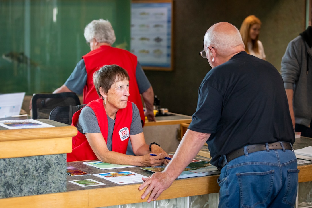 Linda Parpart, a third-year volunteer at the U.S. Army Corps of Engineers’ Fort Peck Interpretive Center and Museum in Fort Peck, Montana, helps answer questions by visitors, June 21, 2025, during its 20th anniversary celebration.