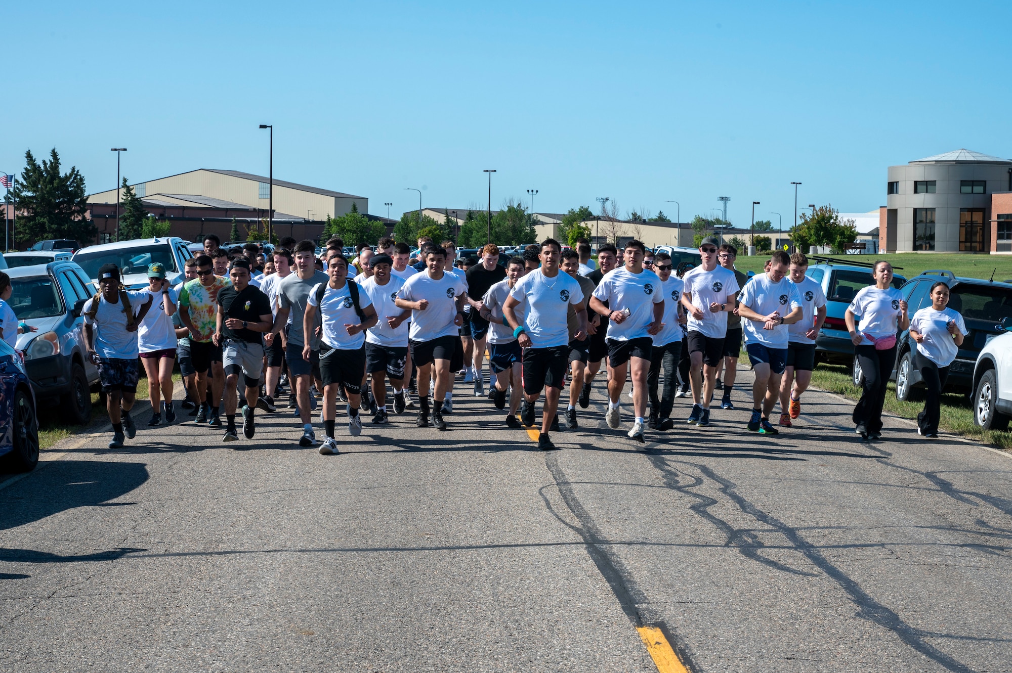 A group of Airmen assigned to the 891st Missile Security Forces squadron run in the Mental Health color run at Minot Air Force Base, North Dakota, June 30, 2025. The run encourages movement, connection and a healthy lifestyle.