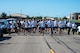A group of Airmen assigned to the 891st Missile Security Forces squadron run in the Mental Health color run at Minot Air Force Base, North Dakota, June 30, 2025. The run encourages movement, connection and a healthy lifestyle.