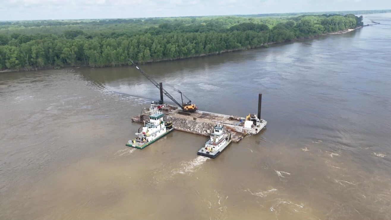 Project Manager Zach Cook, and his dedicated Project Delivery Team secured the win on the FY25 Dike Stone Repair Project by balancing the constraints of safety, time, budget, and quality, creating value for our partners, stakeholders, and the American taxpayer. 

This important $2.9 million Mississippi River channel maintenance project placed 82k tons of Graded Stone A to repair and restore multiple dikes to “As-Built” conditions at Sycamore Chute, Tennessee. 

Dikes assist in maintaining the navigation channel by helping to promote scouring of the riverbed during low water. Dikes are most effective during low water periods and are considering the more permanent solution in maintaining navigation as opposed to repetitive maintenance dredging.

The area of the project dikes was the most dredged spot within the Memphis District area of responsibility during the last three low-water seasons. The dike repair project minimizes the future need for dredging this location. (Courtesy Photo)