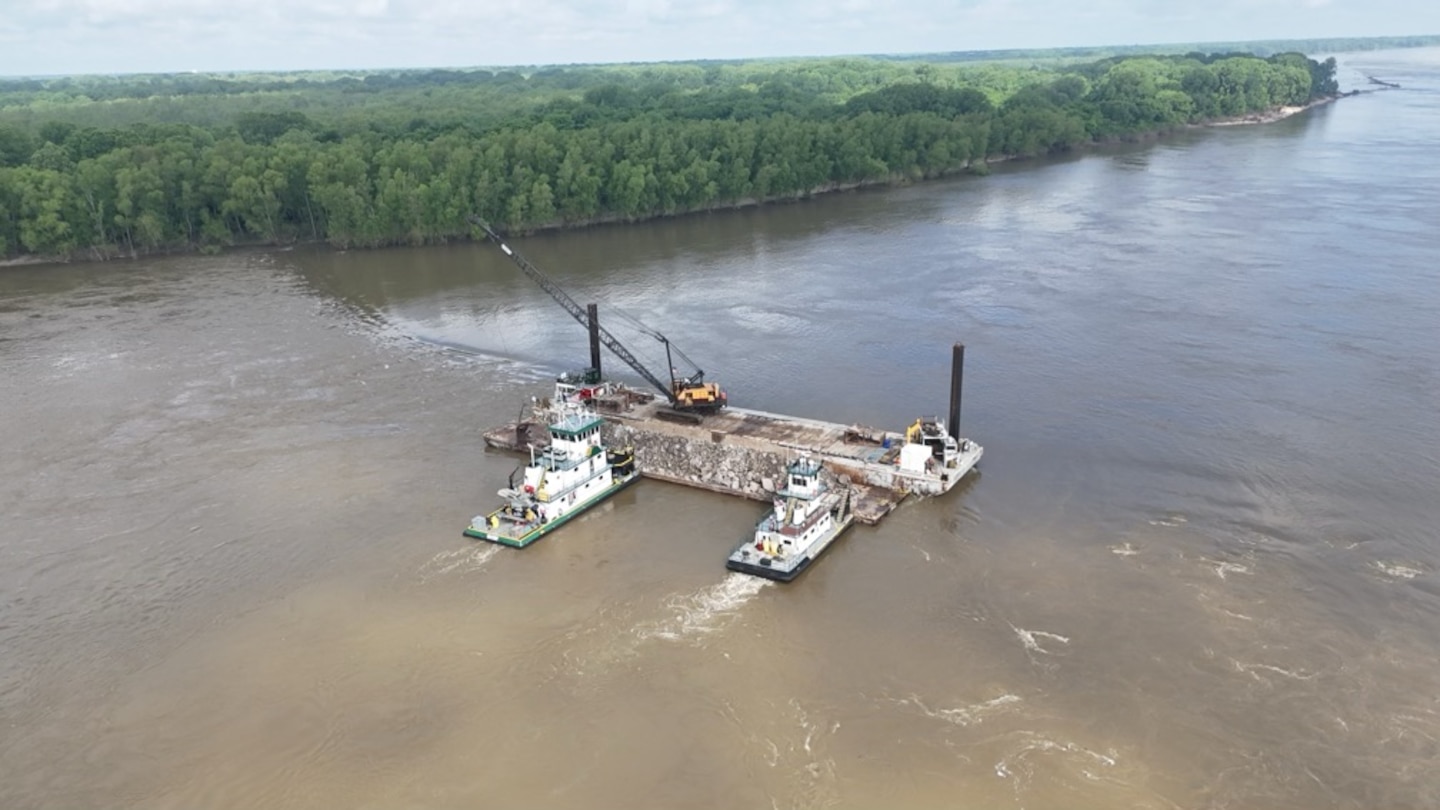 Project Manager Zach Cook, and his dedicated Project Delivery Team secured the win on the FY25 Dike Stone Repair Project by balancing the constraints of safety, time, budget, and quality, creating value for our partners, stakeholders, and the American taxpayer. 

This important $2.9 million Mississippi River channel maintenance project placed 82k tons of Graded Stone A to repair and restore multiple dikes to “As-Built” conditions at Sycamore Chute, Tennessee. 

Dikes assist in maintaining the navigation channel by helping to promote scouring of the riverbed during low water. Dikes are most effective during low water periods and are considering the more permanent solution in maintaining navigation as opposed to repetitive maintenance dredging.

The area of the project dikes was the most dredged spot within the Memphis District area of responsibility during the last three low-water seasons. The dike repair project minimizes the future need for dredging this location. (Courtesy Photo)