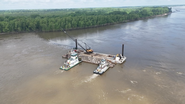 Project Manager Zach Cook, and his dedicated Project Delivery Team secured the win on the FY25 Dike Stone Repair Project by balancing the constraints of safety, time, budget, and quality, creating value for our partners, stakeholders, and the American taxpayer. 

This important $2.9 million Mississippi River channel maintenance project placed 82k tons of Graded Stone A to repair and restore multiple dikes to “As-Built” conditions at Sycamore Chute, Tennessee. 

Dikes assist in maintaining the navigation channel by helping to promote scouring of the riverbed during low water. Dikes are most effective during low water periods and are considering the more permanent solution in maintaining navigation as opposed to repetitive maintenance dredging.

The area of the project dikes was the most dredged spot within the Memphis District area of responsibility during the last three low-water seasons. The dike repair project minimizes the future need for dredging this location. (Courtesy Photo)