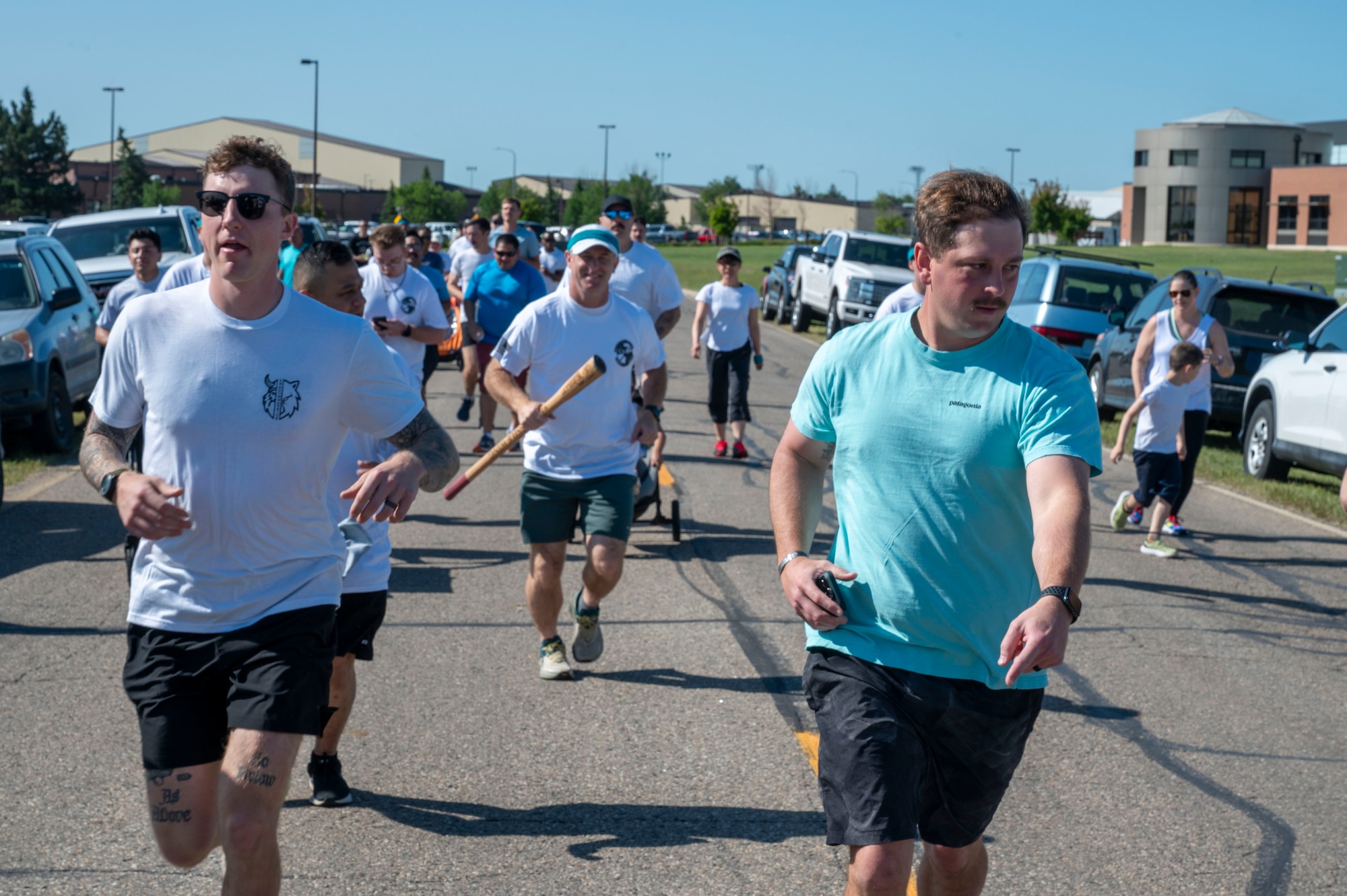 Airmen assigned to the 891st Missile Security Forces squadron run in the Mental Health color run at Minot Air Force Base, North Dakota, June 30, 2025. The Airmen participated in a 1.8 mile run to spread awareness about mental health.