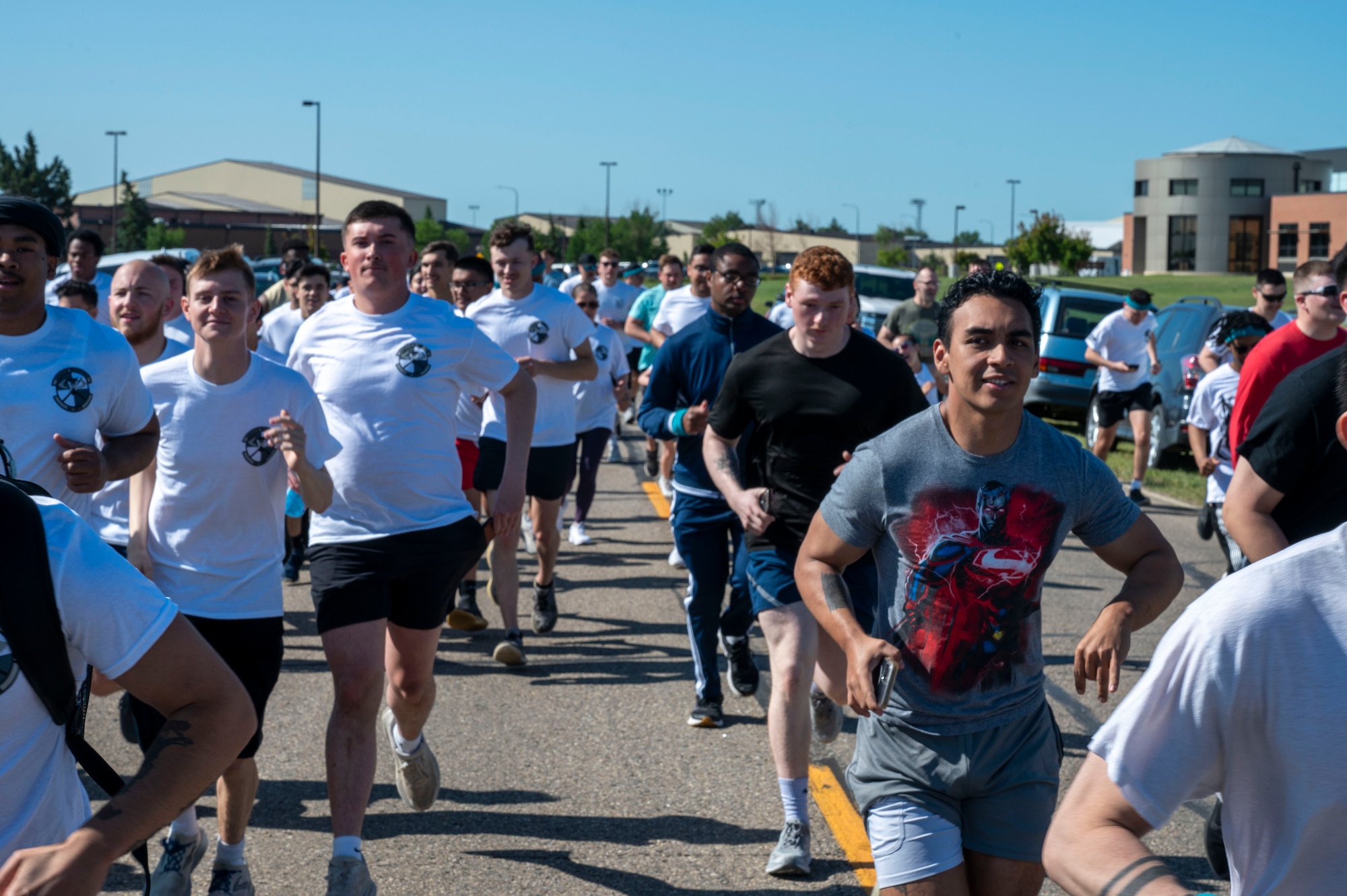 Airmen assigned to the 891st Missile Security Forces squadron run in the Mental Health color run at Minot Air Force Base, North Dakota, June 30, 2025. The Airmen participated in a 1.8 mile run to spread awareness about mental health.
