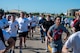 Airmen assigned to the 891st Missile Security Forces squadron run in the Mental Health color run at Minot Air Force Base, North Dakota, June 30, 2025. The Airmen participated in a 1.8 mile run to spread awareness about mental health.