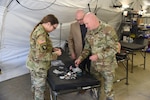 Members of the U.S. Army Institute of Surgical Research command team examine 3D printed dental appliances during a recent field demonstration of 3D printing capabilities hosted by the U.S. Air Force and Army in collaboration with Formlabs, the world’s largest supplier of professional 3D printing machines.