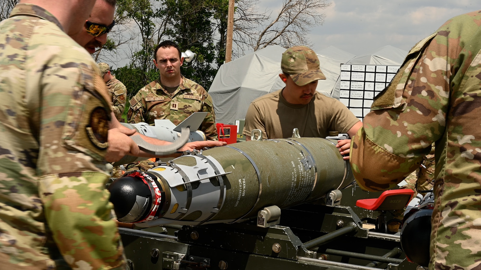 Airmen oversee a munitions build.