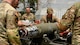 Airmen oversee a munitions build.