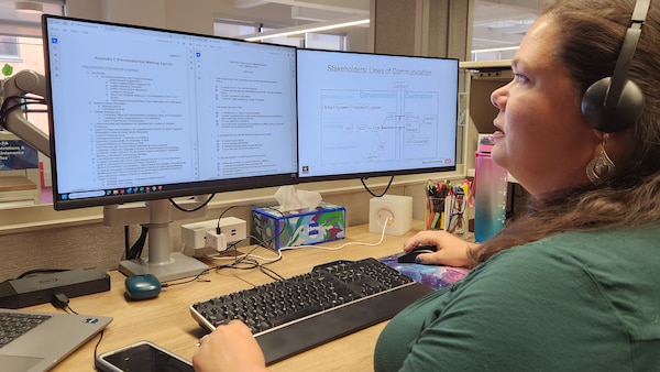 U.S. Army Corps of Engineers, Buffalo District Chief of Construction Contracting Administration Katie Lewis reviews course materials for the Construction Quality Management for Contractors course.