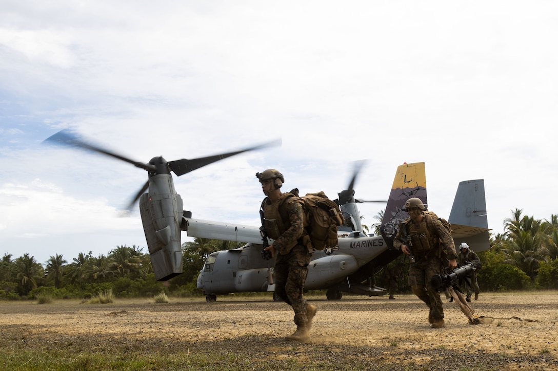 U.S. Marines with 2nd Battalion, 1st Marine Regiment, Marine Rotational Force – Darwin 25.3, exit an MV-22B Osprey assigned to Marine Medium Tiltrotor Squadron (VMM) 364, Marine Aircraft Group 39, 3rd Marine Aircraft Wing, amid a simulated airfield seizure at Berong Airstrip, Palawan, Philippines during KAMANDAG 9, May 30, 2025. KAMANDAG is an annual Philippine Marine Corps and U.S. Marine Corps-led exercise aimed at enhancing the Armed Forces of the Philippines’ defense and ex capabilities by providing valuable training in combined operations with foreign militaries in the advancement of a Free and Open Indo-Pacific. (U.S. Marine Corps photo by Staff Sgt. Luc Boatman)