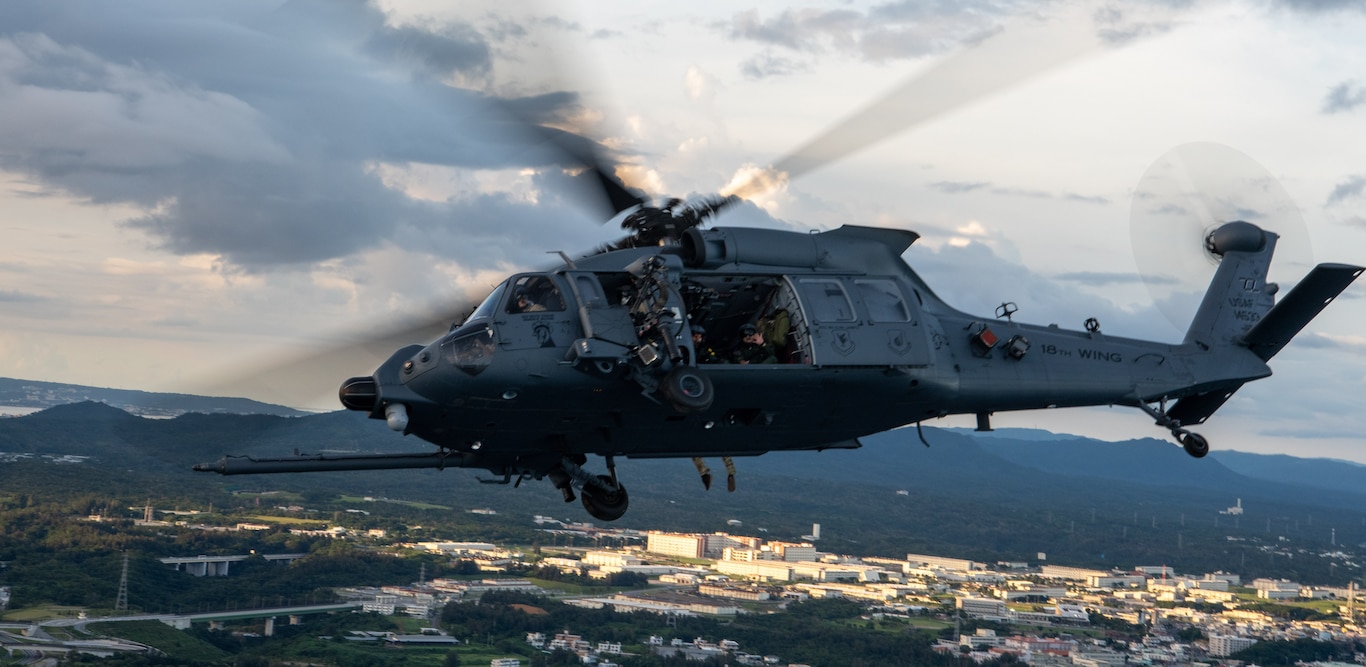 Japan Air Self-Defense Force members from the Naha Air Rescue Squadron ride on a U.S. Air Force HH-60W Jolly Green II assigned to the 33rd Rescue Squadron, in support of exercise Cope Angel 25-1 at Kadena Air Base, Japan, June 26, 2025.