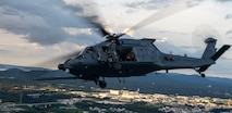 Japan Air Self-Defense Force members from the Naha Air Rescue Squadron ride on a U.S. Air Force HH-60W Jolly Green II assigned to the 33rd Rescue Squadron, in support of exercise Cope Angel 25-1 at Kadena Air Base, Japan, June 26, 2025.