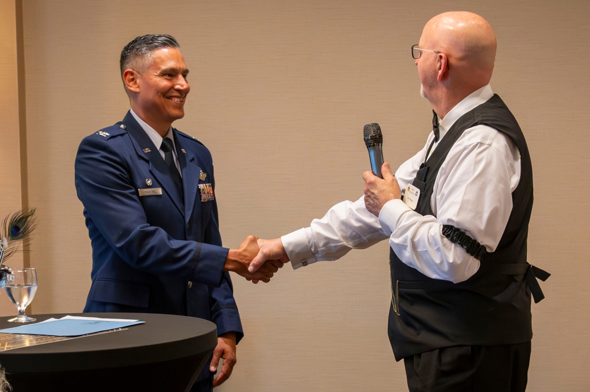 Col. Martinez is coined by Jim Walsh, president of the 307th Bombardment Group.