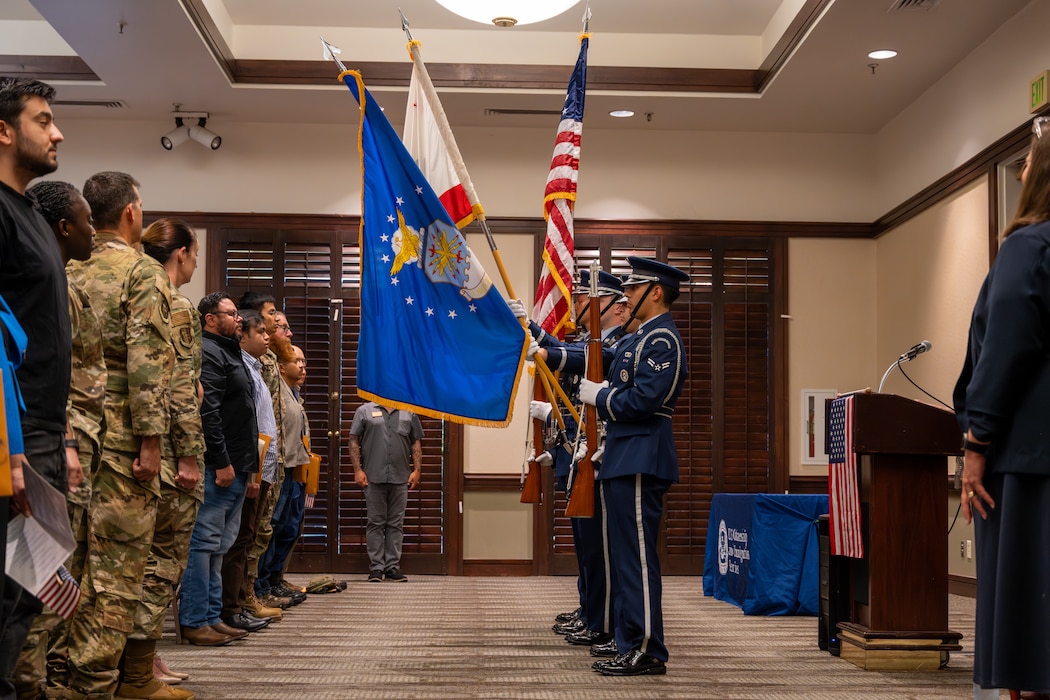 Honor Guard presents flags during ceremony.