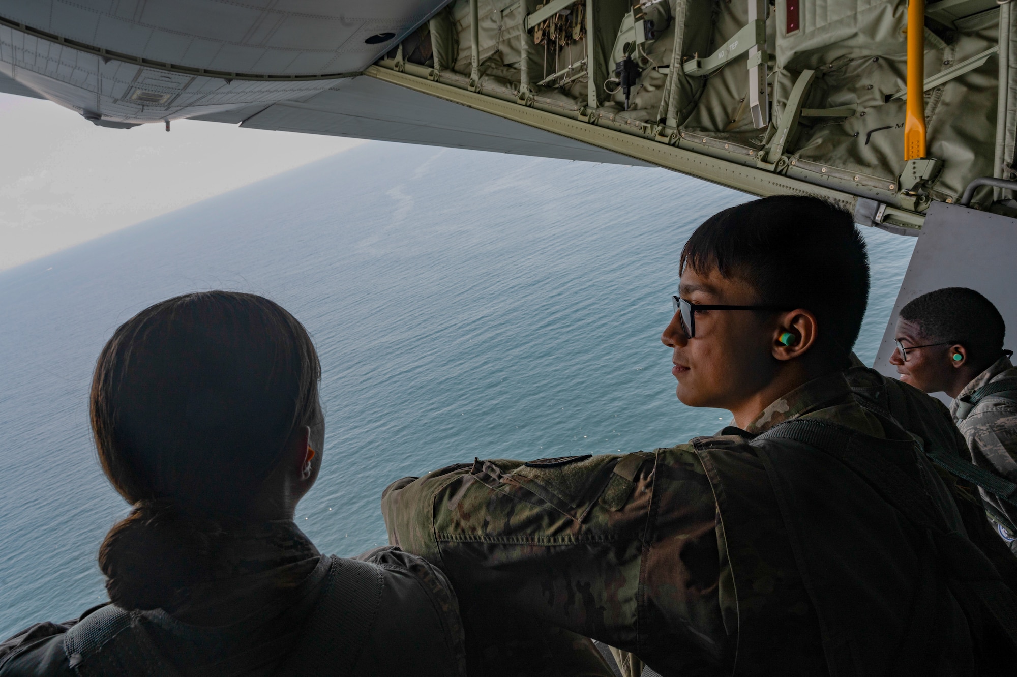 U.S. Air Force Junior ROTC cadets sit on the ramp of a MC-130J Commando II assigned to the 1st Special Operations Wing during an orientation flight near Hurlburt Field, Florida, June 25, 2025.