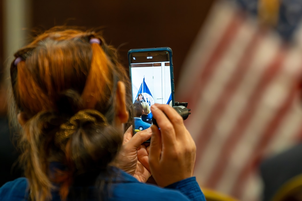 Woman records ceremony on phone