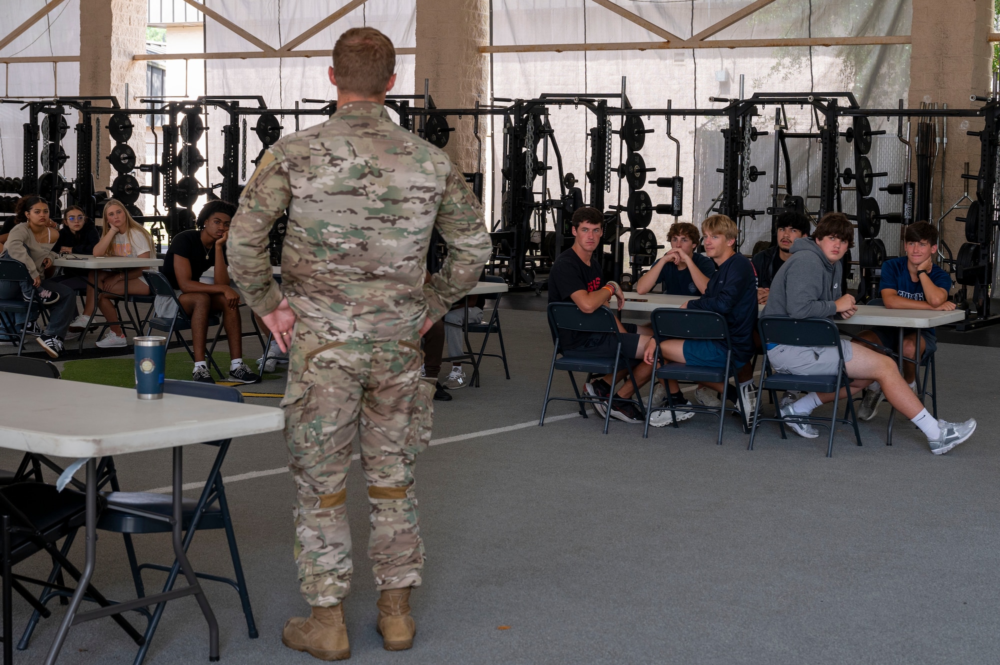 A U.S. Air Force special tactics officer assigned to the 24th Special Operations Wing briefs students from Fort Walton Beach High School at Hurlburt Field, Florida, May 8, 2025.