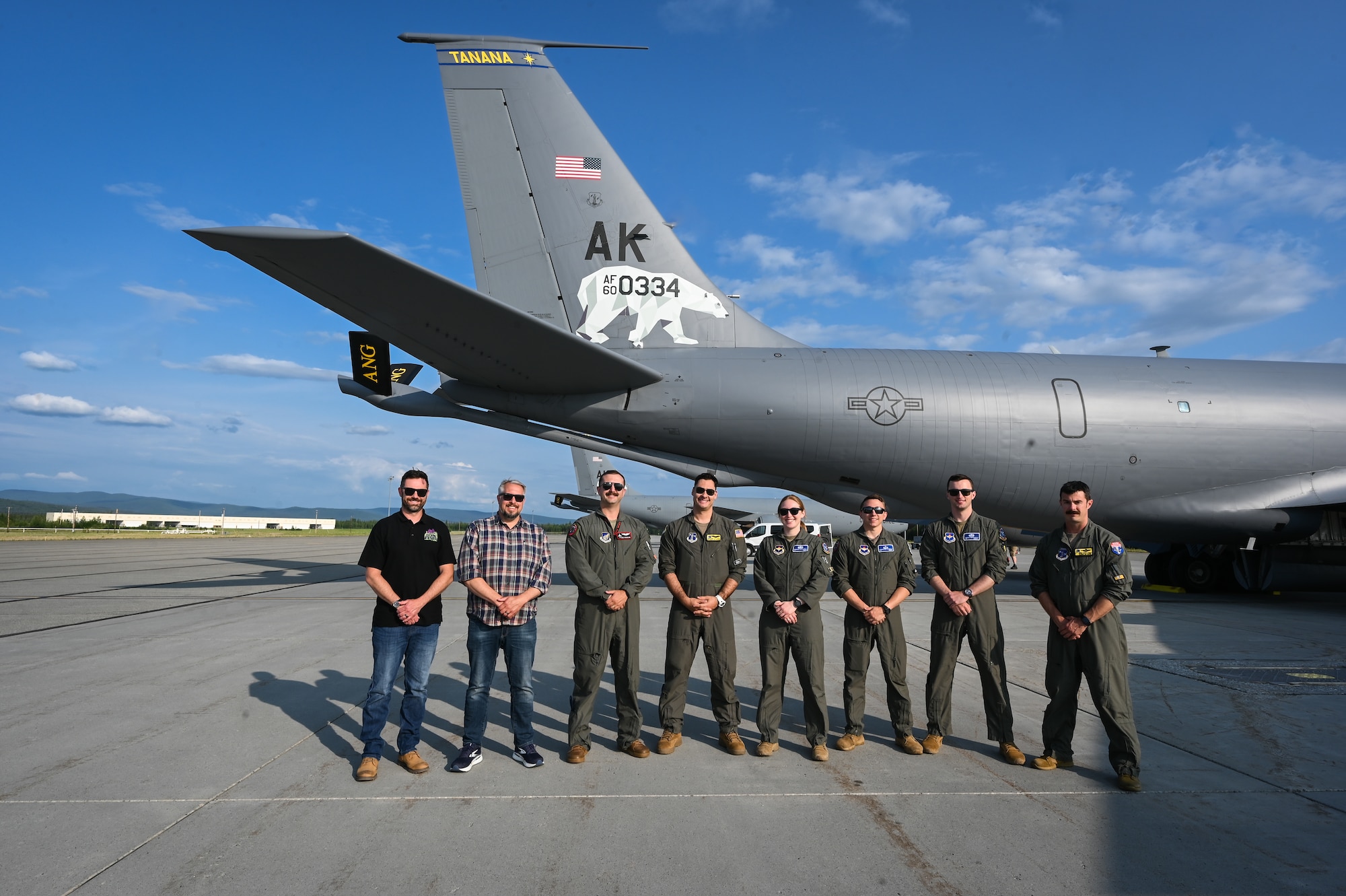 Civic leaders and newly commissioned U.S. Air Force pilot trainees gather to take a photo with the 168th Wing KC-135 Stratotanker aircrew in front of the Alaska Air National Guard KC-135 following an aerial refueling mission