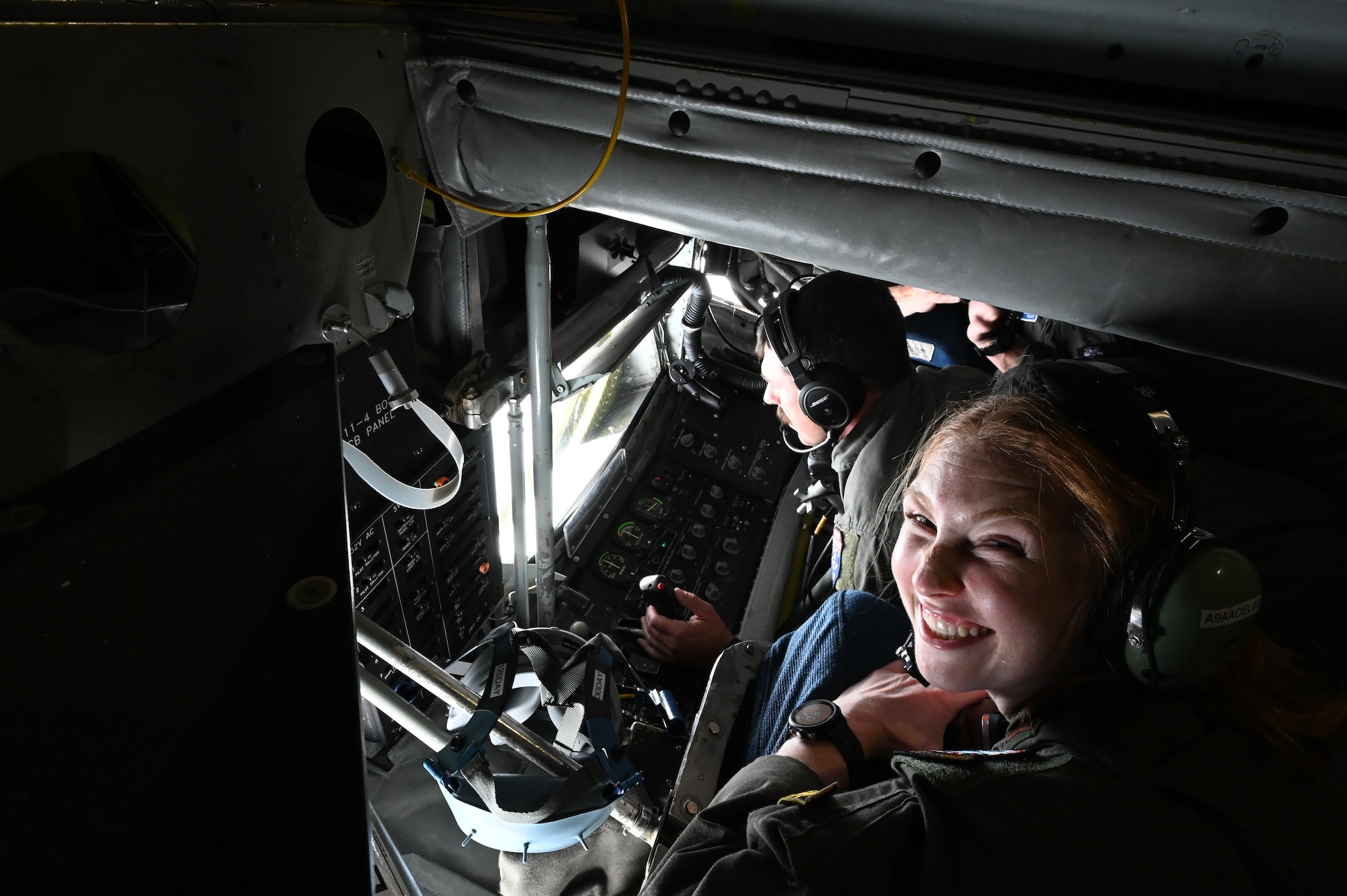 Lt. Annmarie Hackworthy, a newly commissioned U.S. Air Force pilot trainee, smiles during her incentive flight aboard an Alaska Air National Guard KC-135 Stratotanker .