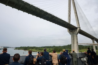 250701-A-LS473-1017 PANAMA CANAL, Panama (July 1, 2025) Sailors aboard the Mercy-class hospital ship USNS Comfort (T-AH 20) pass under Centennial Bridge as they transit the Panama Canal during Continuing Promise 2025, July 1, 2025. Continuing Promise 2025 is the 16th iteration of the U.S. 4th Fleet/U.S. Naval Forces Southern Command-led mission since 2007, which aims to foster goodwill, strengthen existing partnerships with partner nations, and form new partnerships between host nations, non-federal entities, and international organizations. (U.S. Army photo by Cpl. William Hunter)