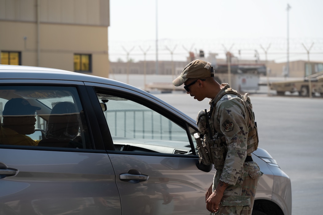 U.S. Air Force Senior Airman Cameron Gay, 379th Expeditionary Security Forces Squadron patrolman, checks credentials at an entry control point within the U.S. Central Command area of responsibility, June 17, 2025. Members of the 379 ESFS are prepared to provide defense anywhere in the world with short notice. (U.S. Air Force Photo by Senior Airman Dieondiere Jefferies)