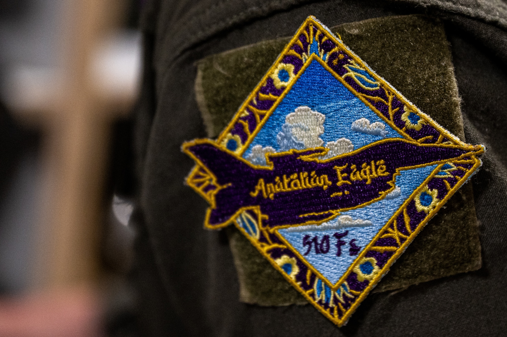 A patch is placed on a pilot's flight suit.