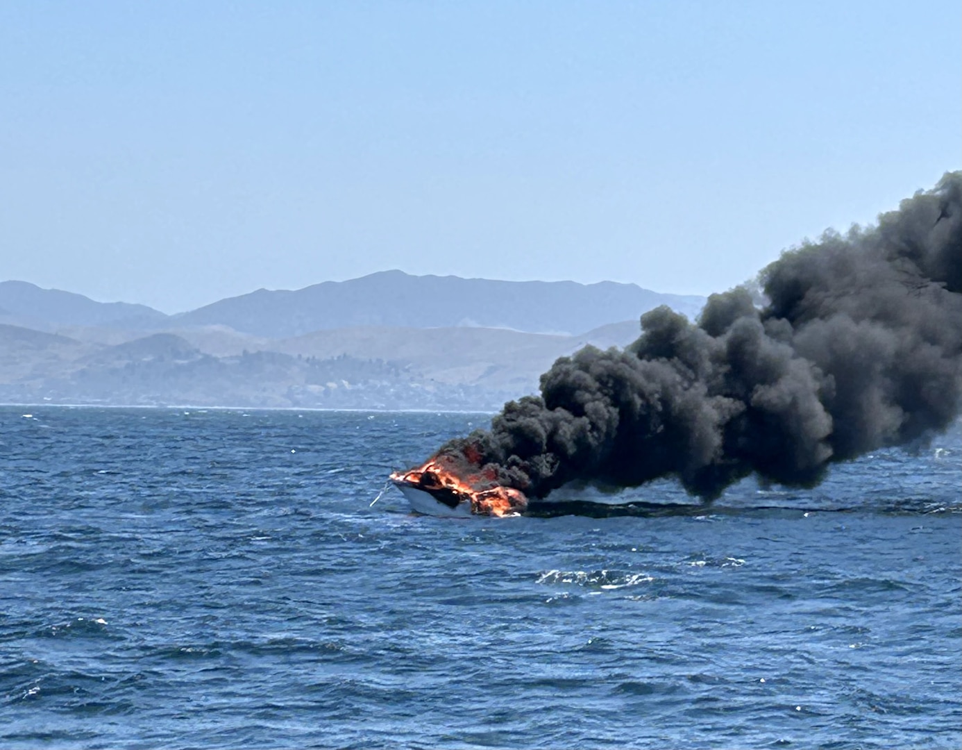 U.S. Coast Guard Station Morro Bay crew members rescued four boaters after their vessel caught fire while in tow approximately five miles off Cayucos, California, July 5, 2025.