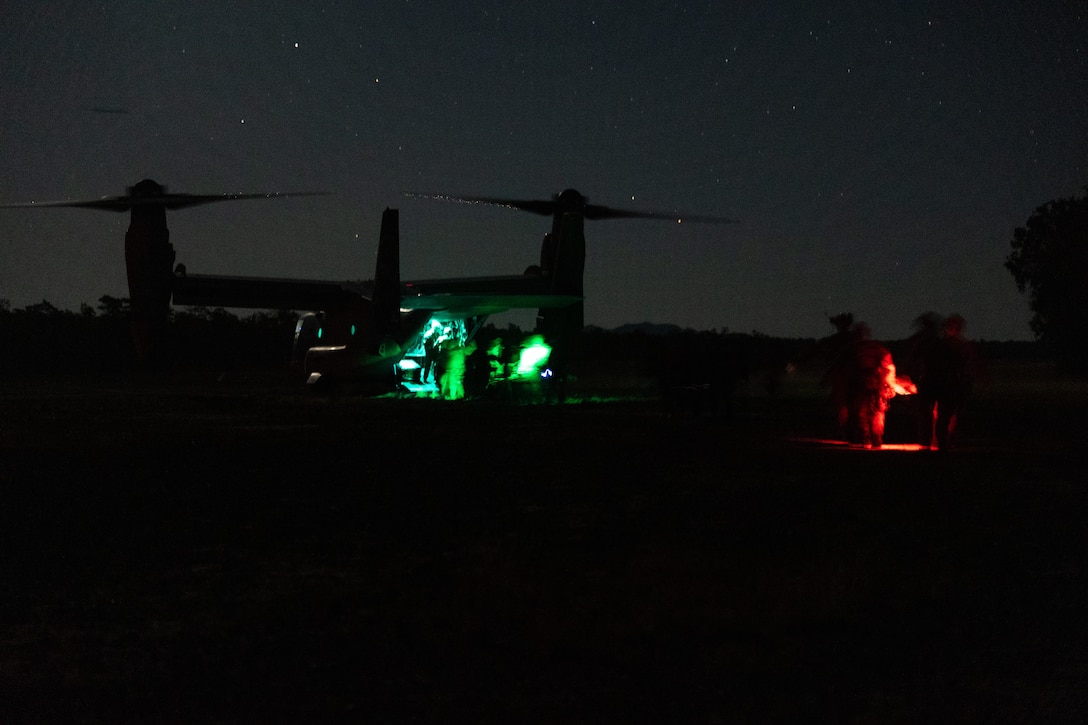 U.S. Marines with Maritime Raid Force, 31st Marine Expeditionary Unit, load simulated casualties onto a U.S. Marine Corps MV-22B Osprey assigned to Marine Medium Tiltrotor Squadron (VMM) 242 (Rein.), 31st MEU, during a limited scale raid exercise at Sam Hill Airfield, Queensland, Australia, July 1, 2025.