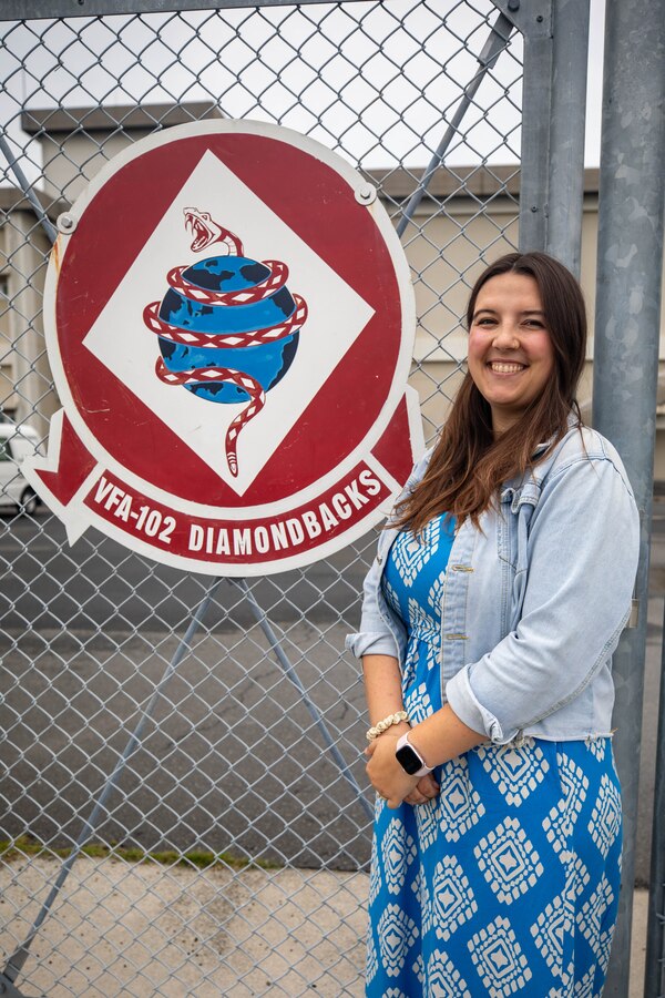 Katie Mintz, U.S. Navy Ombudsman with Strike Fighter Squadron (VFA) 102, Carrier Air Wing (CVW) 5, poses for a photo at Marine Corps Air Station Iwakuni, Japan, June 6, 2025. Mintz was chosen as the recipient of the 2024 Dorothy Flatley award for exceptional support to Sailors, Marines, and their families. (U.S. Marine Corps photo by Sgt. Isaac Orozco)