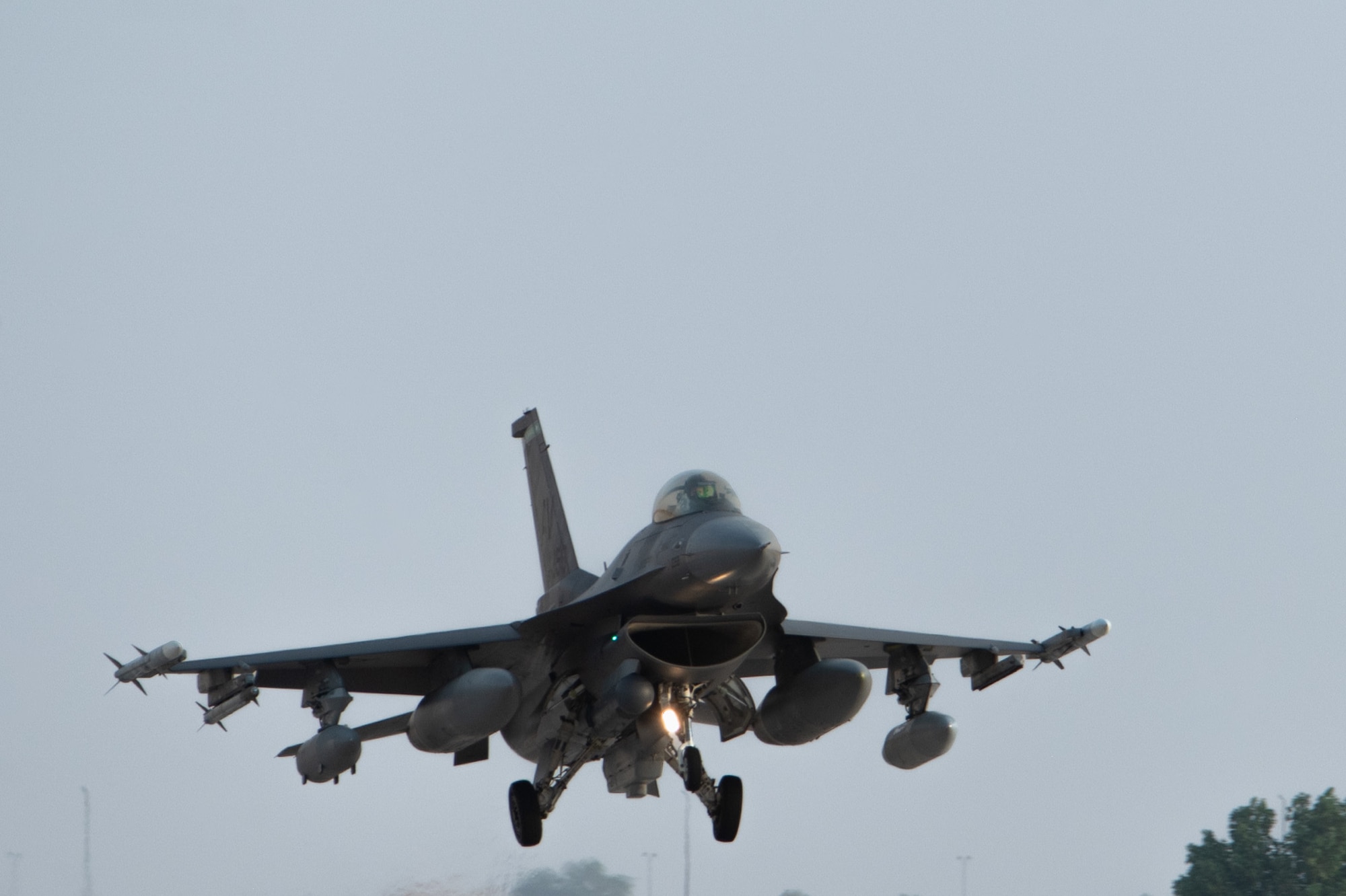 A U.S. Air Force F-16C Fighting Falcon assigned to the 555th Expeditionary Fighter Squadron prepares to land.